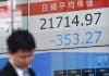 Asia stocks mostly trade higher; Wall Street roars to new record highs