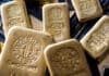 Gold slides on dollar rally as U.S. stimulus remains elusive