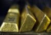 Gold Holds Decline on Dollar Strength as Stimulus Faces Debate