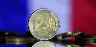 French shares drop, bond risk premium rises after election result