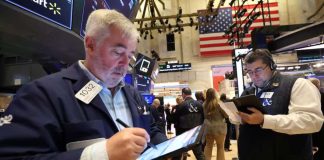 Stocks rise with tech-related shares, notch weekly gains; dollar up