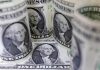 Shares cautious, dollar slips as trade concerns persist